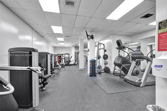 exercise room featuring visible vents and a drop ceiling