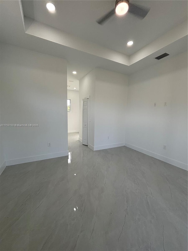 unfurnished room with recessed lighting, a ceiling fan, visible vents, baseboards, and marble finish floor