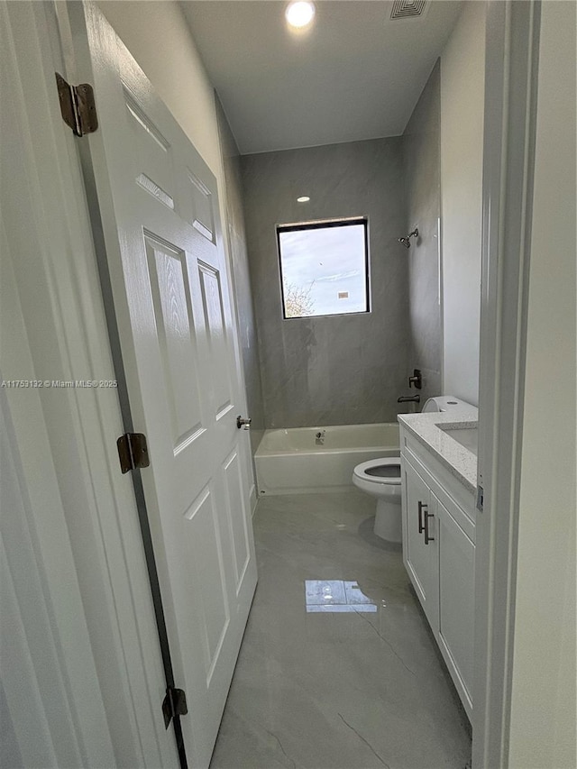 full bath with bathtub / shower combination, vanity, and toilet