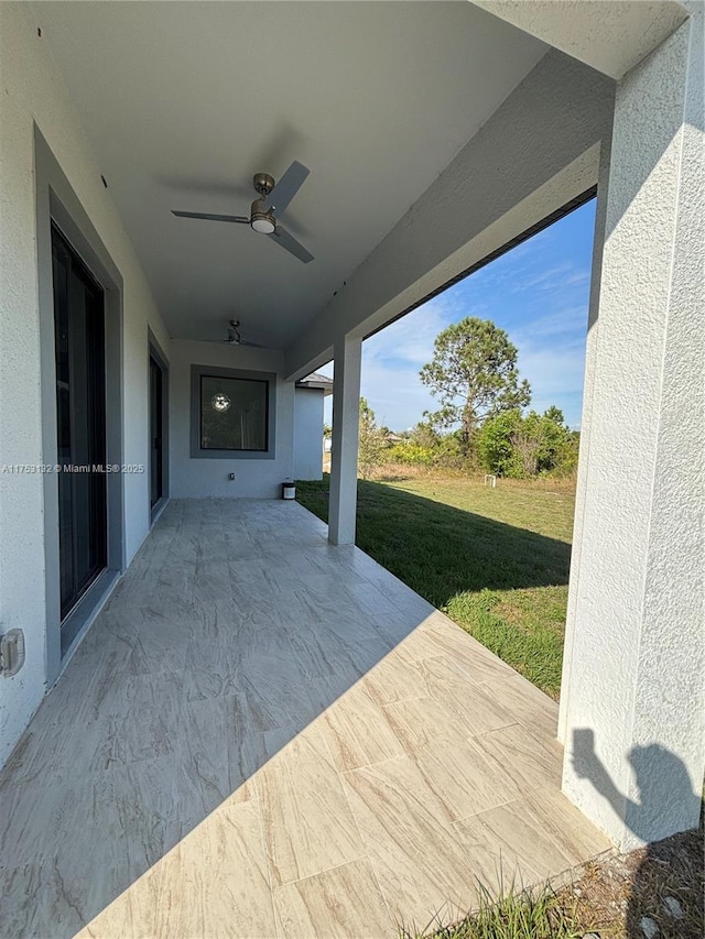 view of patio with ceiling fan