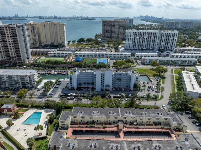 bird's eye view featuring a view of city and a water view