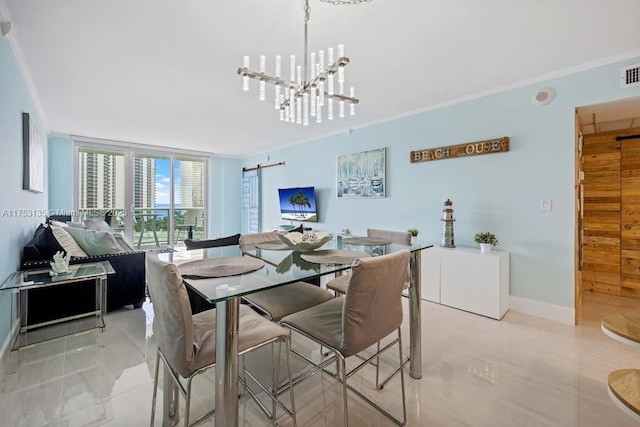 dining space with a barn door, a notable chandelier, baseboards, expansive windows, and crown molding