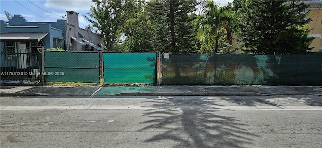 view of gate with fence