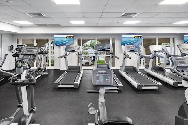 exercise room featuring a drop ceiling and visible vents