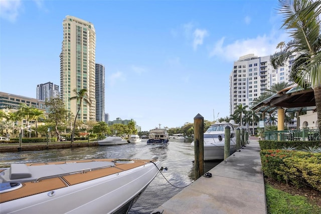 exterior space featuring a water view and a city view