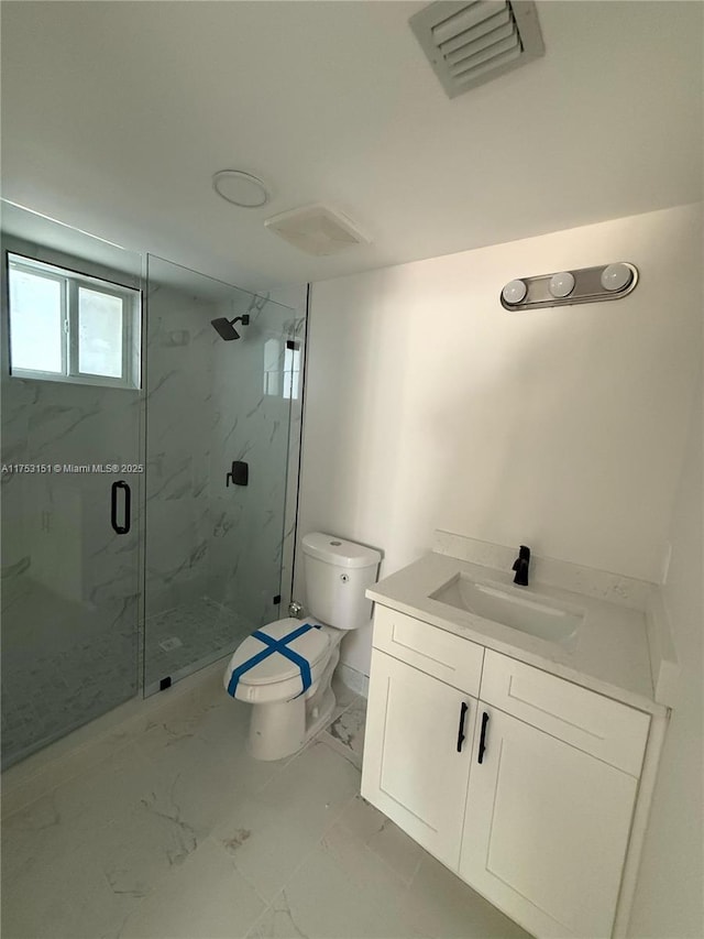 full bathroom featuring toilet, vanity, visible vents, marble finish floor, and a marble finish shower