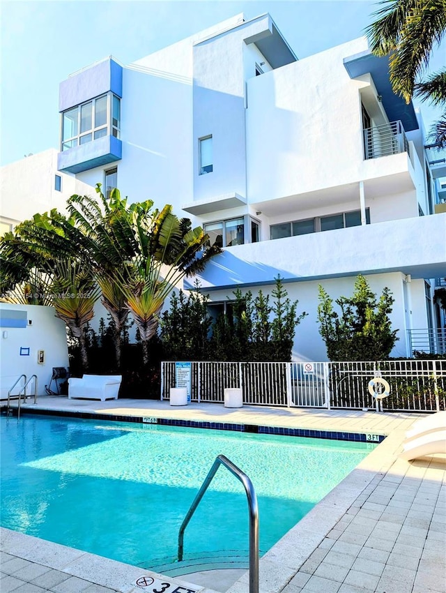 community pool with fence