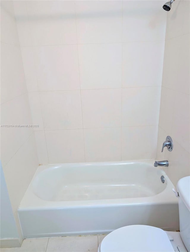 full bath featuring toilet and tile patterned floors