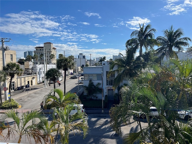 view of street featuring sidewalks and a city view