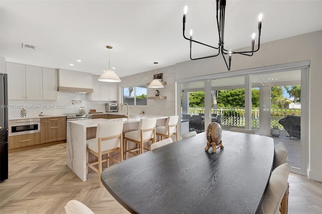 dining room featuring recessed lighting, french doors, and visible vents