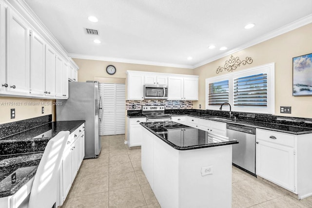 kitchen with white cabinetry, visible vents, stainless steel appliances, and a sink