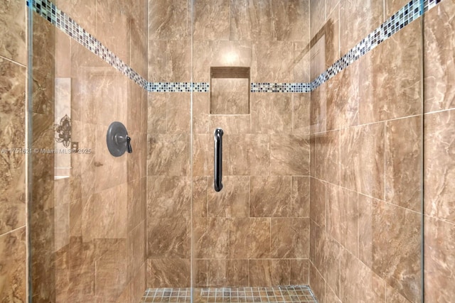 room details featuring a shower stall