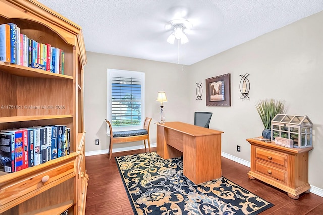 office with dark wood-style floors, baseboards, and a textured ceiling