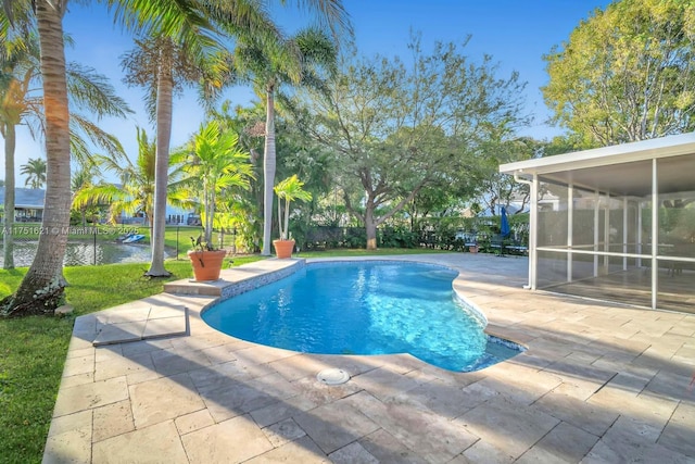 view of swimming pool with a fenced in pool, a sunroom, a water view, fence, and a patio area