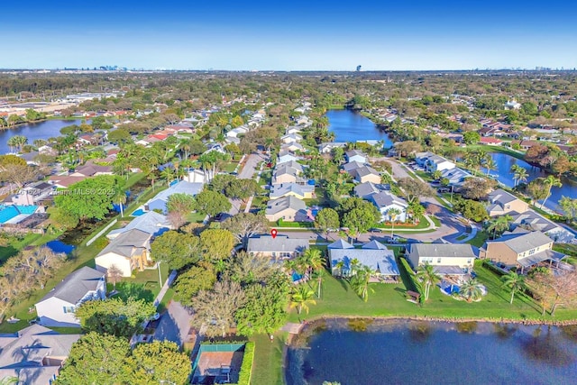 bird's eye view featuring a residential view and a water view