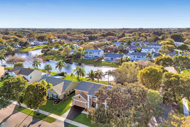 bird's eye view with a residential view and a water view