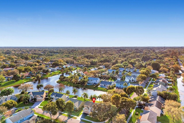 bird's eye view with a water view and a residential view