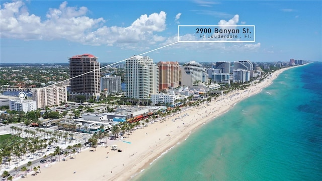 bird's eye view featuring a beach view, a water view, and a city view