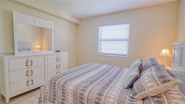 bedroom featuring light tile patterned floors