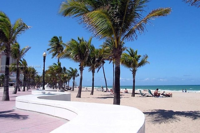 view of community featuring a water view and a view of the beach