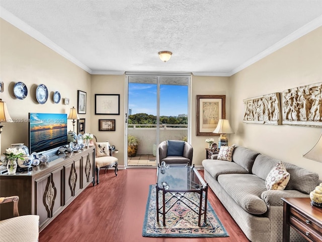 living area featuring baseboards, a textured ceiling, ornamental molding, and dark wood-style flooring