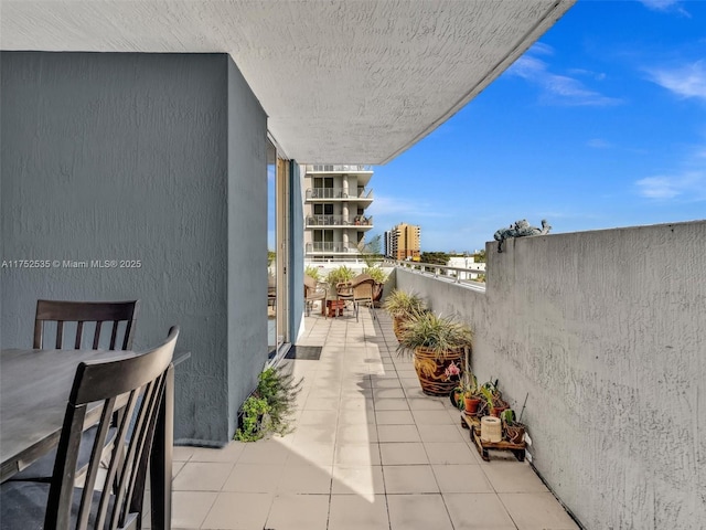 view of patio featuring a balcony