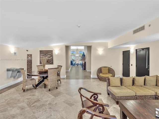 dining space featuring visible vents and baseboards