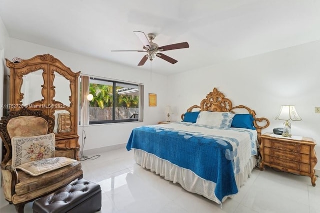 bedroom featuring baseboards and ceiling fan