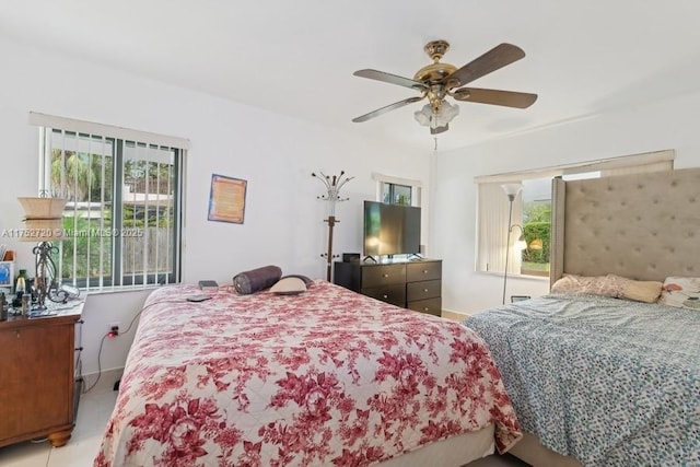 bedroom with baseboards and a ceiling fan