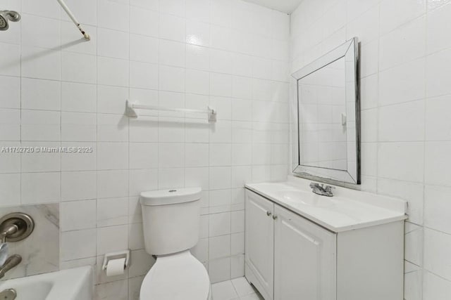 bathroom with a shower, toilet, vanity, a tub, and tile walls