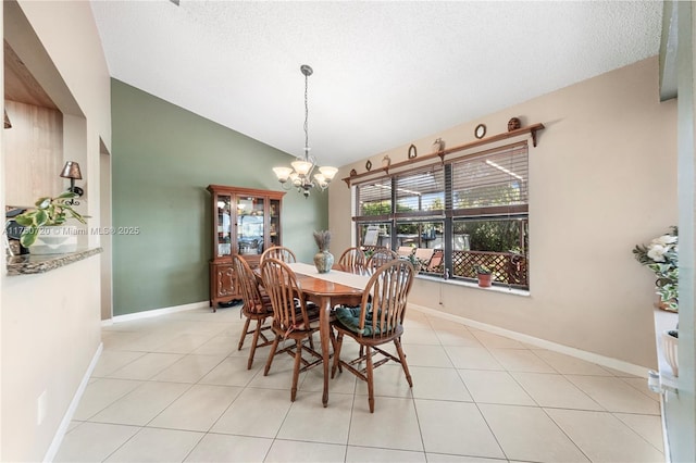 dining room with an inviting chandelier, vaulted ceiling, a textured ceiling, and light tile patterned flooring