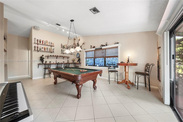 rec room with vaulted ceiling, light tile patterned flooring, billiards, and visible vents