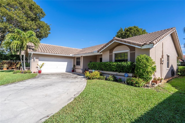 ranch-style home featuring a front yard, a tiled roof, and an attached garage