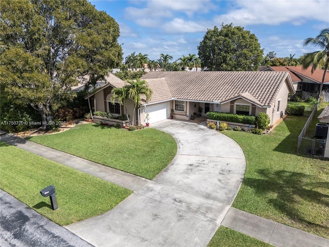 ranch-style house with a front yard, driveway, a tiled roof, and an attached garage