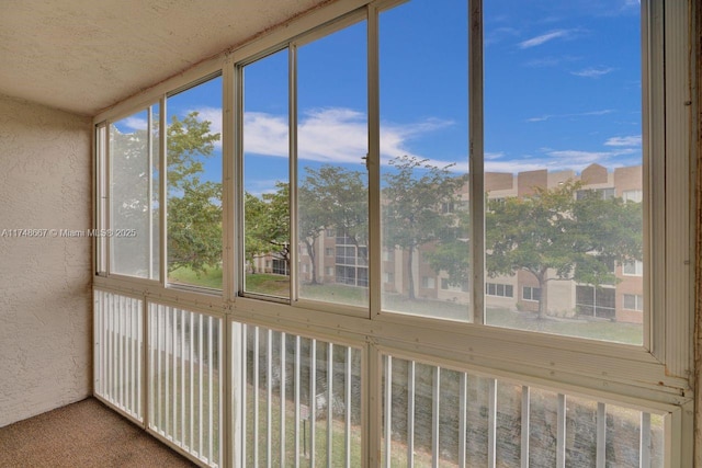 unfurnished sunroom with plenty of natural light