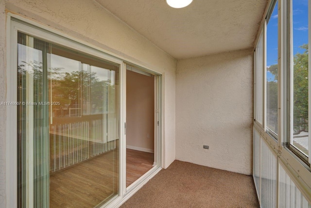 unfurnished sunroom featuring a healthy amount of sunlight