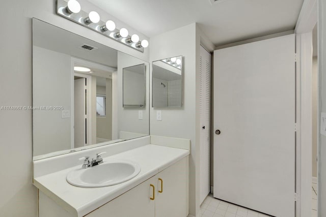 bathroom with vanity and visible vents