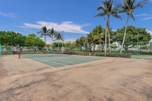 view of sport court featuring fence