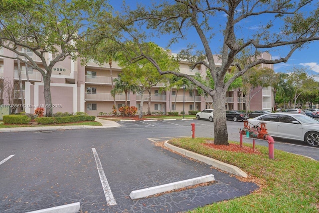 view of road with a residential view and curbs