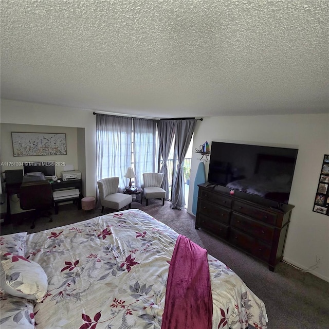 carpeted bedroom with access to outside and a textured ceiling