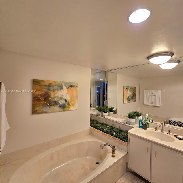 full bath with a bath and vanity