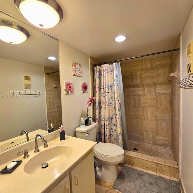 bathroom with a tile shower, toilet, and recessed lighting