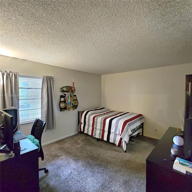bedroom with carpet flooring and a textured ceiling