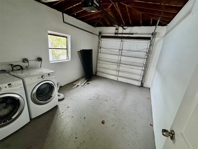 garage with washer and dryer and a garage door opener