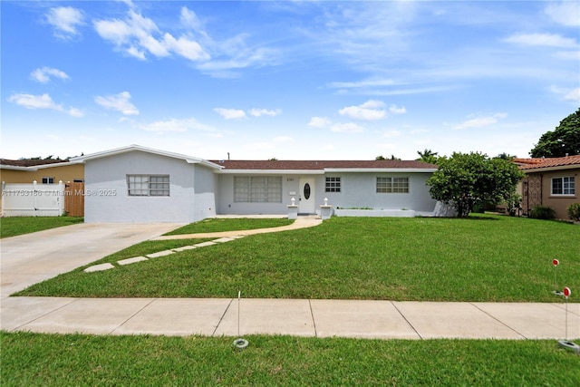 single story home featuring a front yard, fence, and stucco siding