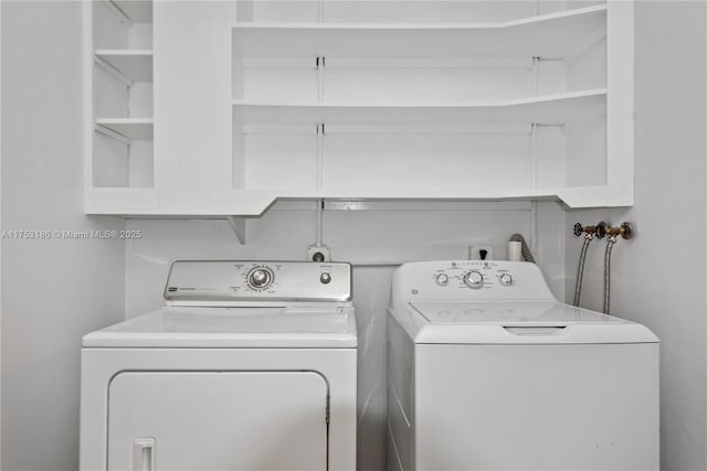 laundry room featuring laundry area and separate washer and dryer