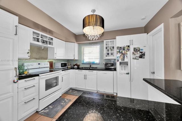 kitchen with glass insert cabinets, white appliances, white cabinetry, and a sink