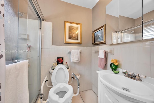 full bathroom with toilet, a shower stall, tile walls, and vanity