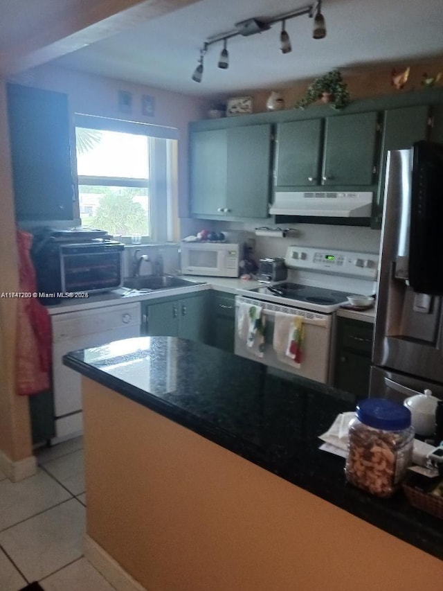 kitchen with a toaster, light tile patterned flooring, a sink, white appliances, and under cabinet range hood