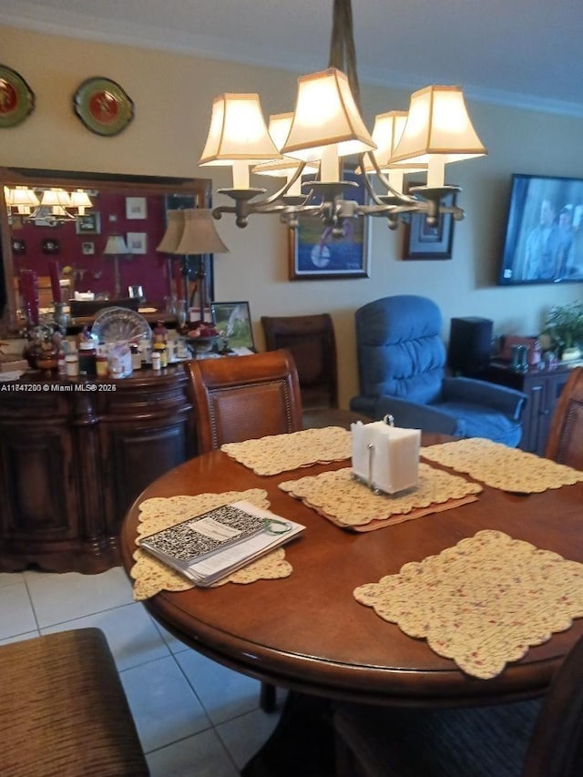 tiled dining room with ornamental molding and a notable chandelier